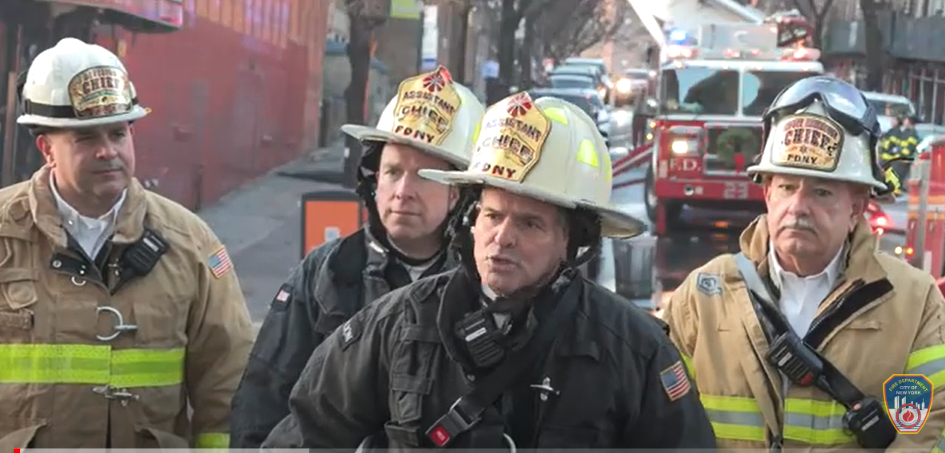 At least one person has been injured after a colossal commercial fire broke out in New York City early Wednesday and spread to nearly a half-dozen businesses in the Bronx. Pictured speaking at center is Tom Currao, NYPD deputy fire chief said.