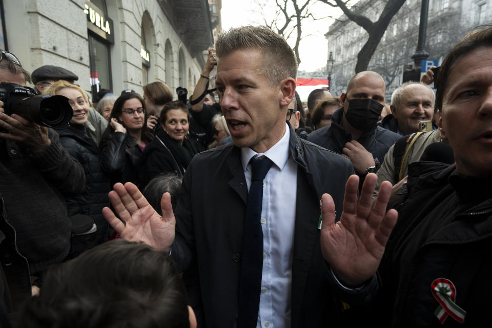 Péter Magyar, the former husband of one-time justice minister and Orbán ally Judit Varga meets with people in the crowd after his speech on Hungary's National Day in Budapest on Friday, March 15. 2024. Magyar, who was once an insider within Orbán's Fidesz party, addressed a crowd of around 10,000 people in Budapest where he announced his plans to form a new political party to challenge Fidesz's 14-year grip on power and act as an alternative to Hungary's fragmented opposition. (AP Photo/Denes Erdos)