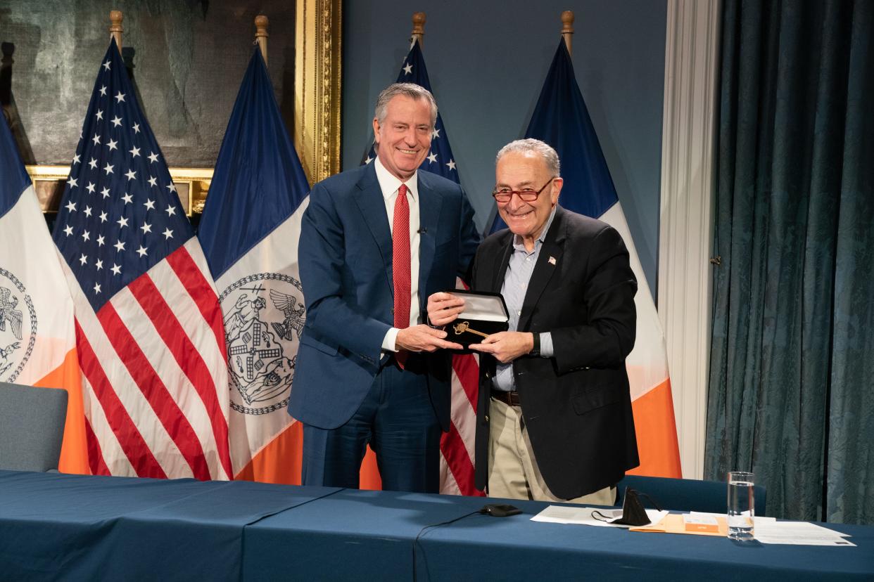 Mayor Bill de Blasio, left, presents U.S. Sen. Chuck Schumer the key to New York City at New York City Hall on Wednesday. 