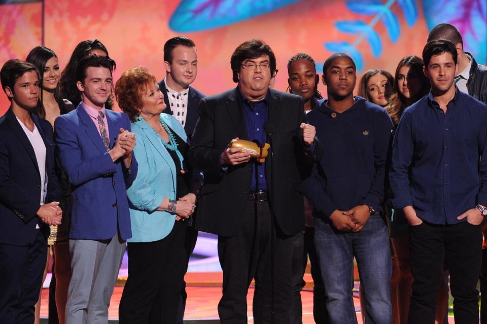 Writer/producer Dan Schneider (C) accepts the Lifetime Achievement Award onstage with actors from his shows during Nickelodeon's 27th Annual Kids' Choice Awards (Getty Images)