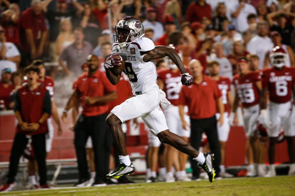 Tyrone Scott (19) of the Missouri State Bears carries the ball for a touchdown as the Bears took on the Arkansas Razorback at Arkansas on Saturday, September 17, 2022.