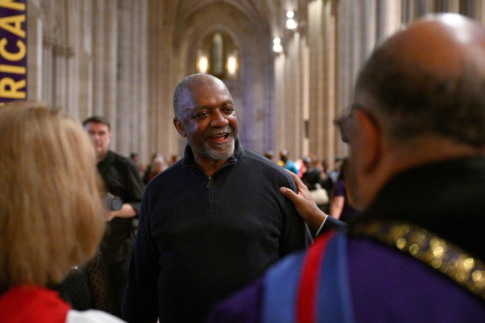 Artist Kerry James Marshall, center, speaks to attendees after an unveiling and dedication ceremony at the Washington National Cathedral for the new stained-glass windows with a theme of racial justice, Saturday, Sept. 23, 2023, in Washington. The new windows, titled “Now and Forever," are based on a design by Marshall. Marshall, who was born in Birmingham in 1955, invited anyone viewing the new windows, or other artworks inspired by social justice, “to imagine oneself as a subject and an author of a never-ending story is that is still yet to be told.” (AP Photo/Nick Wass)