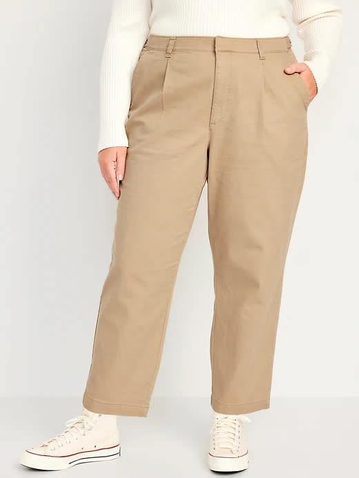 model wears tan High-Waisted Pleated Chino Ankle Pants