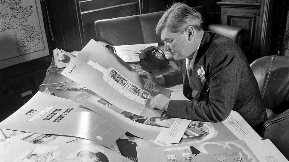 Britain's then-health minister Aneurin Bevan, who played a crucial role in the establishment of the NHS, reviews the public information campaign in 1948. - Popperfoto/Getty Images