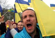 A pro-Ukrainian supporter shouts slogans during mass rally in the eastern Ukrainian city of Donetsk, on April 17, 2014