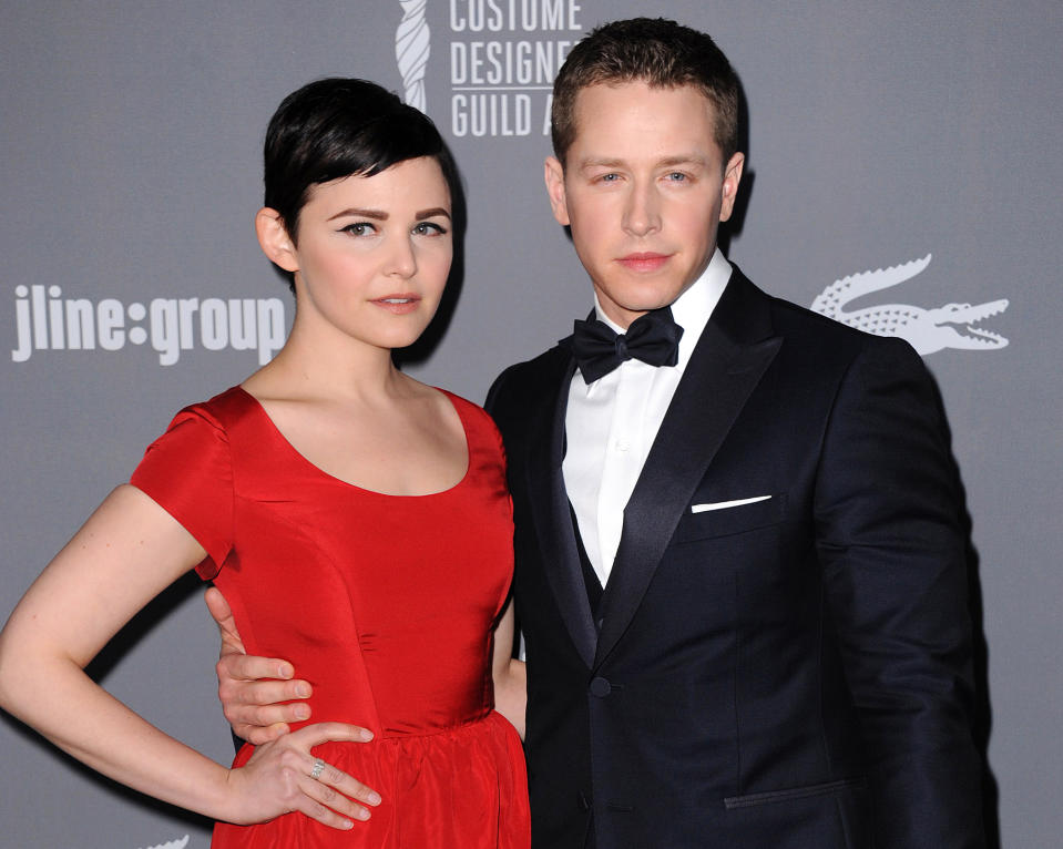FILE - This Feb. 19, 2013 file photo shows Ginnifer Goodwin, left, and Josh Dallas at the 15th Annual Costume Designers Guild Awards in Beverly Hills. The actors, who play Snow White and Prince Charming on ABC’s “Once Upon a Time,” are expecting their first child together. Goodwin’s representative confirmed the news, first reported by People magazine, on Wednesday, Nov. 20. No other details were available. The couple became engaged last month. (Photo by Jordan Strauss/Invision/AP, File)
