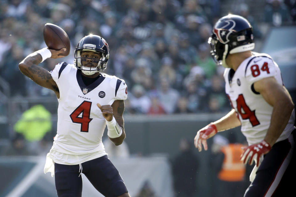 Houston Texans' Deshaun Watson (4) passes as Ryan Griffin (84) looks on during the first half of an NFL football game against the Philadelphia Eagles, Sunday, Dec. 23, 2018, in Philadelphia. (AP Photo/Matt Rourke)