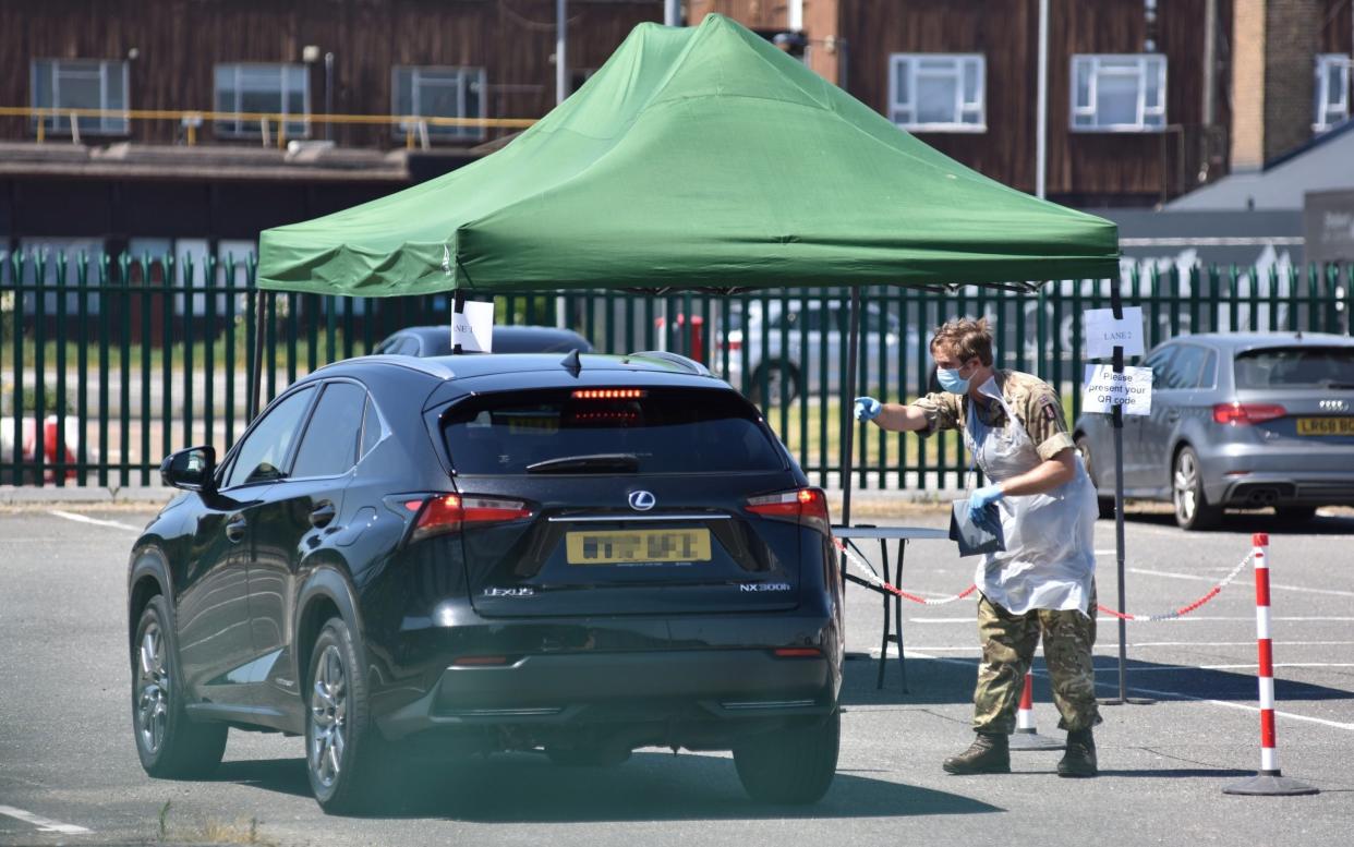 A car stops at a mobile coronavirus testing facility at Southend Airport, in Essex - John Keeble/Getty Images Europe