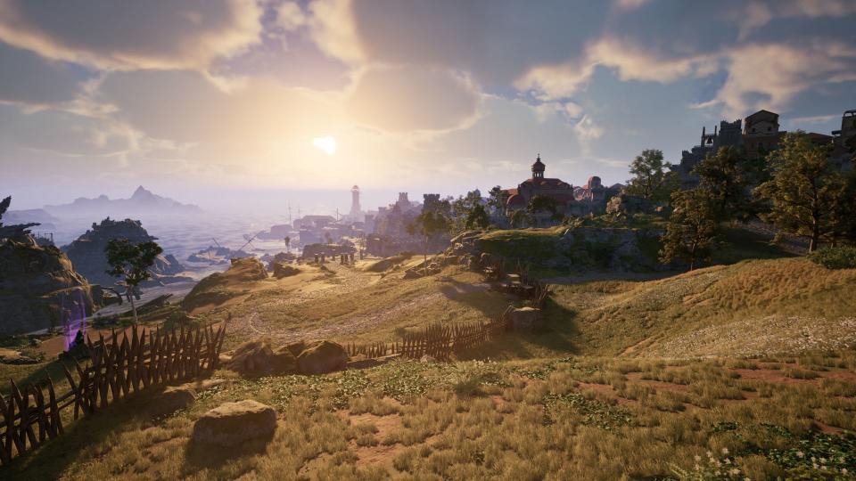Avowed — a screenshot of a rolling, sunny hillside, which descends toward a cliffside harbor city. Spiked wooden barricades cross the approaching road.