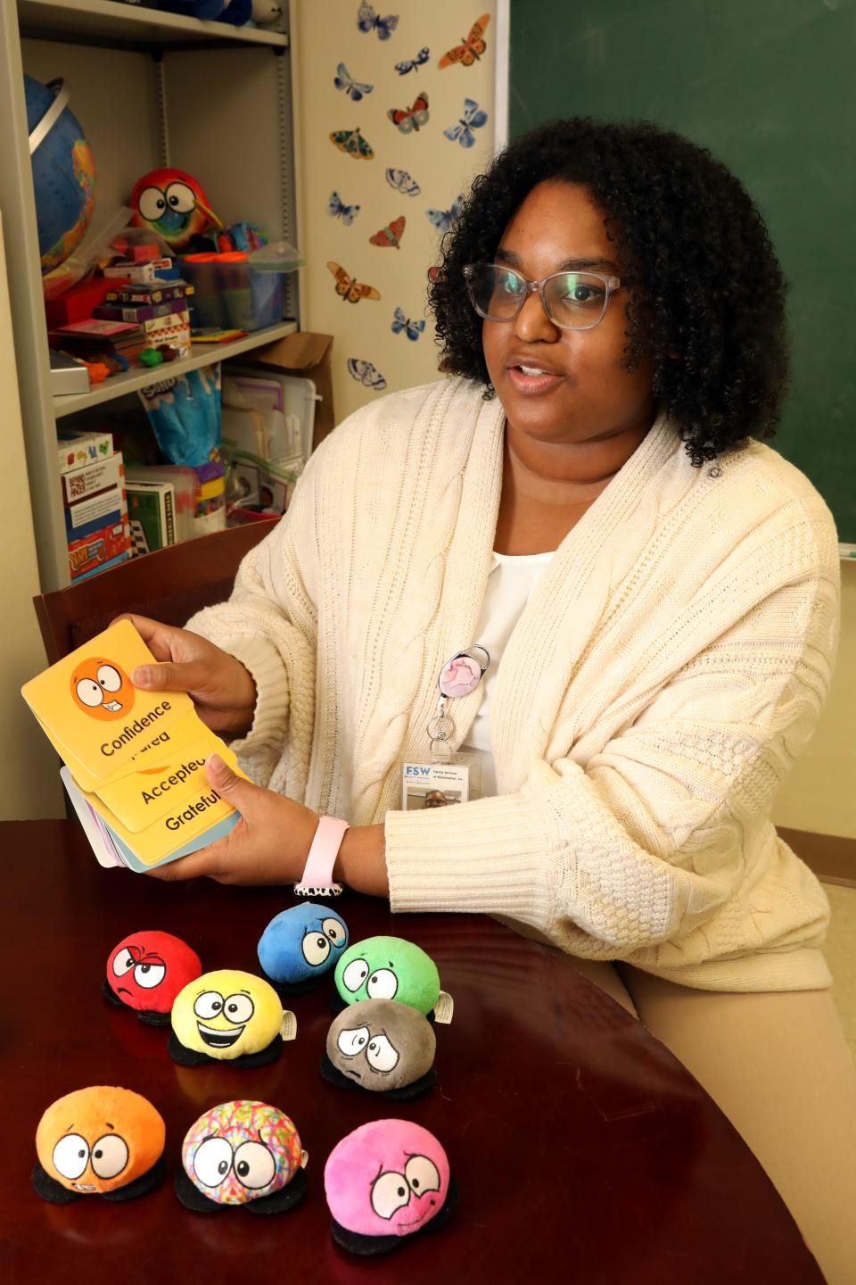 Bilingual mental health clinician Jennifer German shows the flash cards and plush toys she uses to discuss feelings with students at Park Avenue School in Port Chester March 6, 2024. She is employed by Family Services of Westchester and has an office in the school for the students to access therapy without leaving the building.
