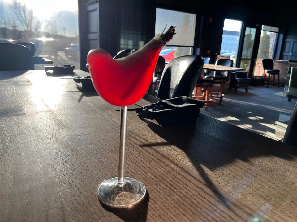 The Katniss Cosmo, served in a bird-shaped glass, is a signature cocktail and tribute to Louisville native Jennifer Lawrence's role in "The Hunger Games" series.