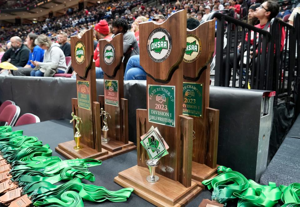 Trophies and medals are displayed during the finals of the 2023 state wrestling tournament.