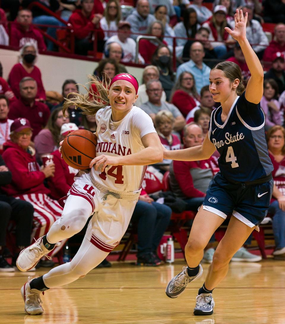 Indiana Hoosier guard Sara Scalia (14) drives to the basket defended by Penn St. Lady Lion guard Shay Ciezki (4) during the basketball game between the Penn St. Lady Lions and Indiana Hoosiers at Simon Skjodt Assembly Hall in Bloomington, IN.