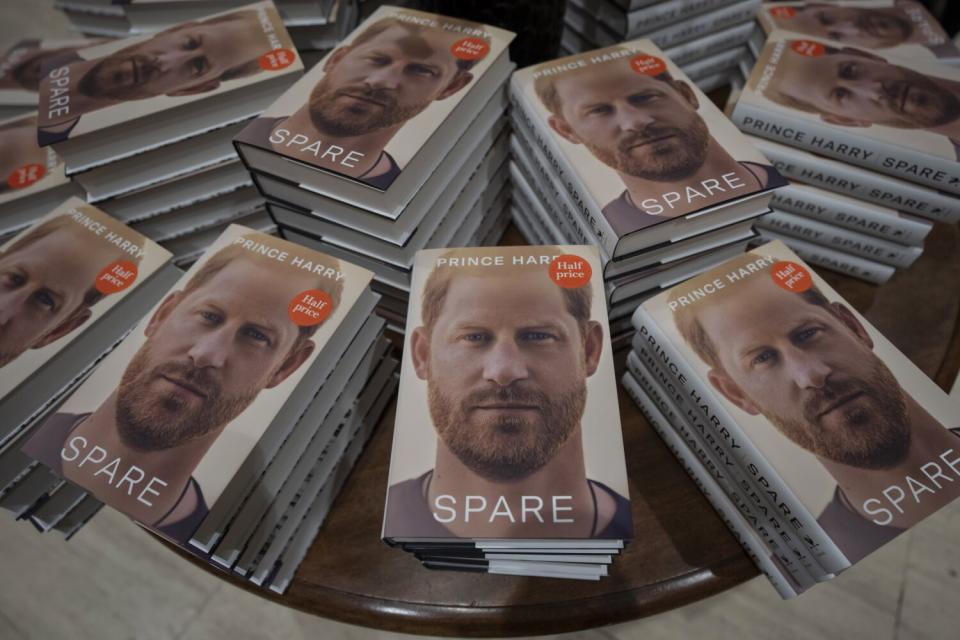 Stacks of a book with a man's face on it