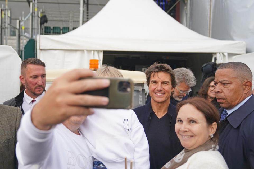 Tom Cruise poses for a selfie ahead of the show honouring the Queen (Steve Parsons/PA) (PA Wire)