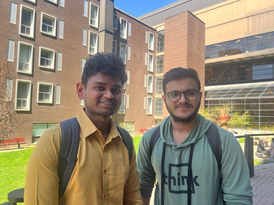 Aditya Kahar, left, and Smid Panchal, right, are studying at the University of Winnipeg, after coming to Canada in 2022.  