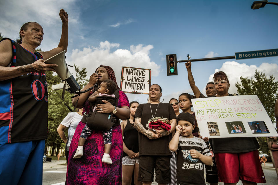 Nekima Levy-Pounds speaks during a vigil for William "Billy" Hughes on Monday, Aug. 6, 2018 in St. Paul, Minn. The Bureau of Criminal Apprehension said in a statement Tuesday, Aug. 7, that William James Hughes, 43, died of multiple gunshot wounds early Sunday after officers responded to a 911 call of multiple shots fired on the upper floor of the apartment building where he lived. (Richard Tsong-Taatarii/Star Tribune via AP) /Star Tribune via AP)