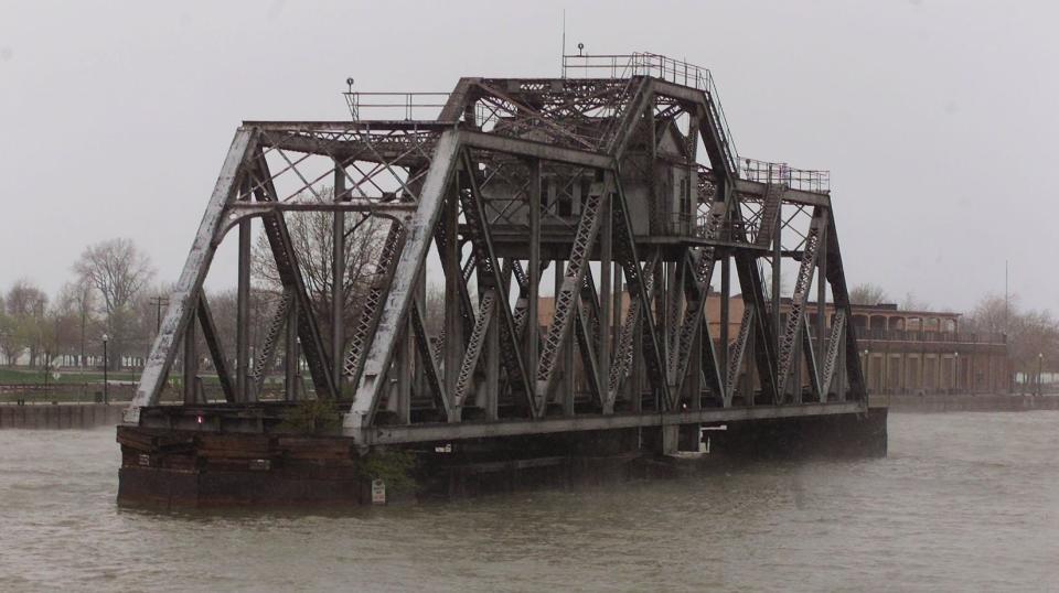A photo of the Hojack Swing Bridge taken from the Irondequoit side of the Genesee River, Monday, April 22, 2002. The bridge was abandoned in the open position in 1994 and demolished nearly two decades later.
