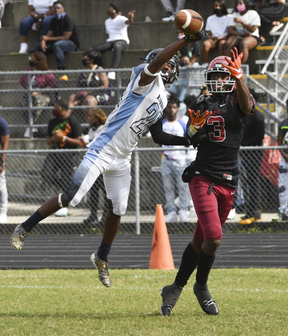 Ribault's Roger Thompson (23) defends against Raines wider receiver Quincy Burroughs (3) in the first half action of the Northwest Classic football game Saturday, October 17, 2020 at Raines High School in Jacksonville, Florida. [Stan Badz/Special to The Florida Times-Union]