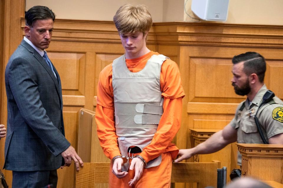 Jeremy Everett Goodale, center, enters the courtroom (CEDAR RAPIDS GAZETTE)