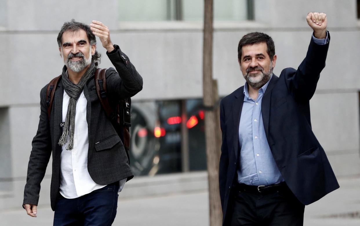 Jordi Cuixart, left, and Jordi Sanchez arrive to the Audiencia Nacional Court to testify within investigation after Catalonia's illegitimate Independence referendum in Madrid on Monday - Anadolu