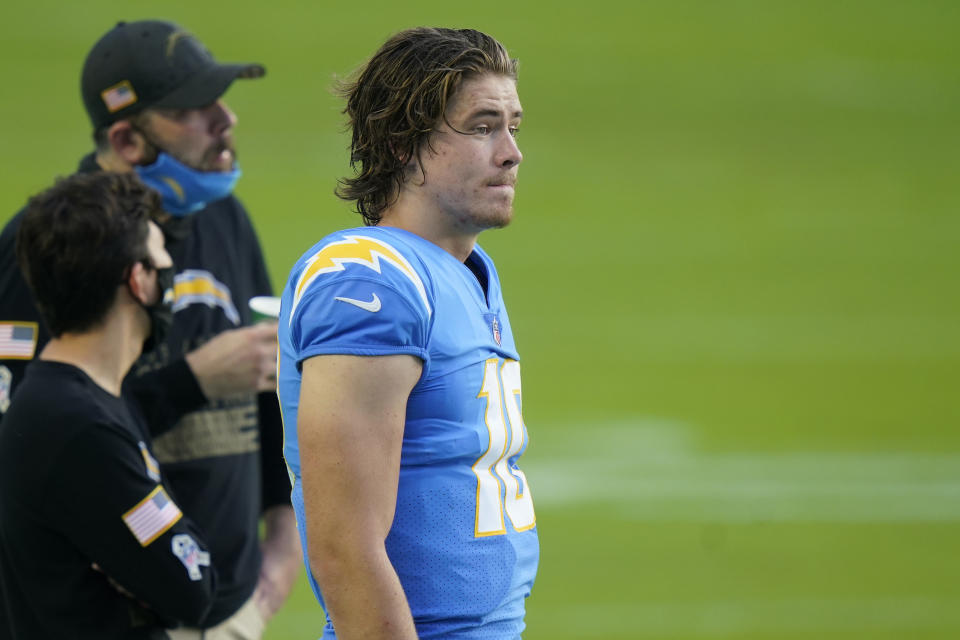 Los Angeles Chargers quarterback Justin Herbert (10) stands on the sidelines, during the first half of an NFL football game against the Miami Dolphins, Sunday, Nov. 15, 2020, in Miami Gardens, Fla. (AP Photo/Lynne Sladky)