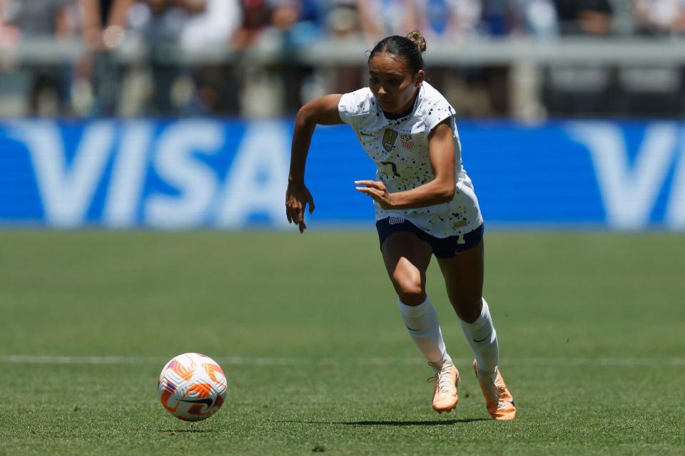 Alyssa Thompson sprints with the ball during an international friendly against Wales on July 9.