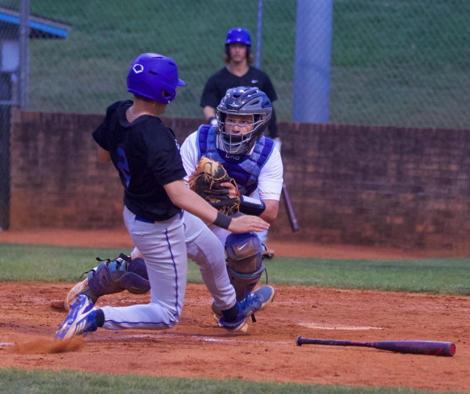 Burns' Reid Stroupe applies the tag to a sliding Cherryville base runner during Thursday's Southern Piedmont 1A/2A baseball final.