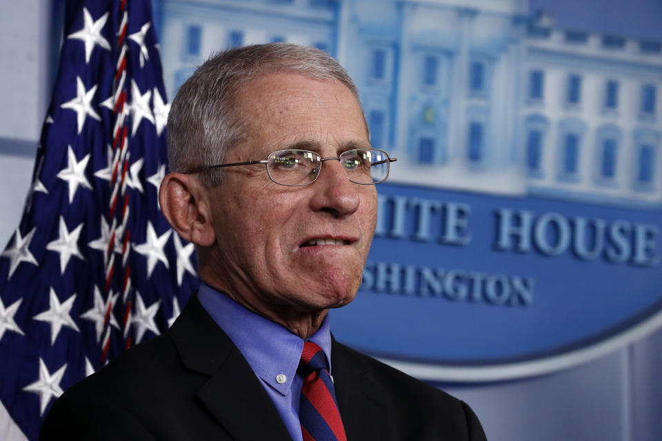 Dr. Anthony Fauci, director of the National Institute of Allergy and Infectious Diseases, as President Donald Trump speaks about the coronavirus in the James Brady Briefing Room, Wednesday, March 25, 2020, in Washington. (AP Photo/Alex Brandon)