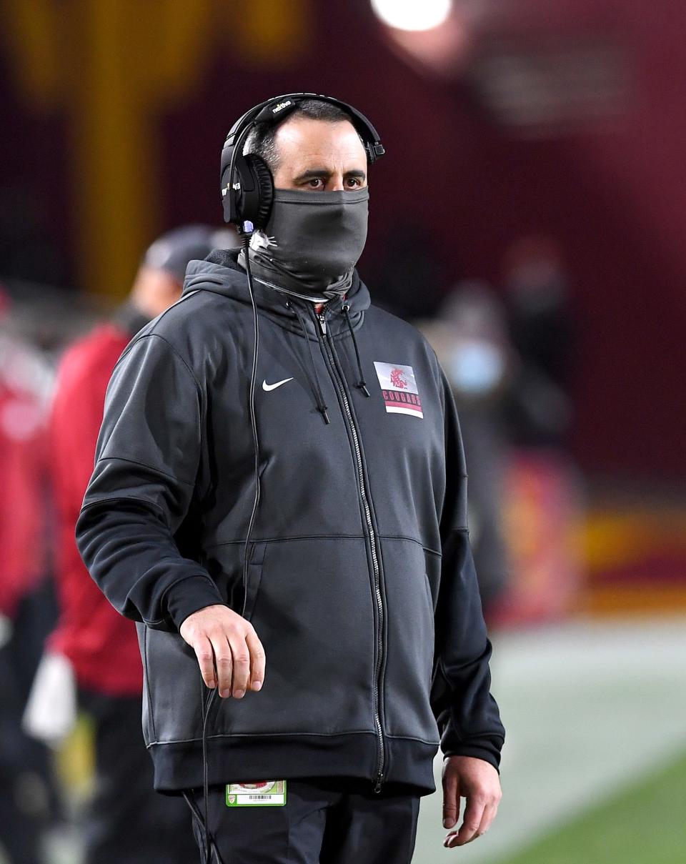 Washington State Cougars head coach Nick Rolovich looks on from the sidelines during a Dec. 6, 2020 game.