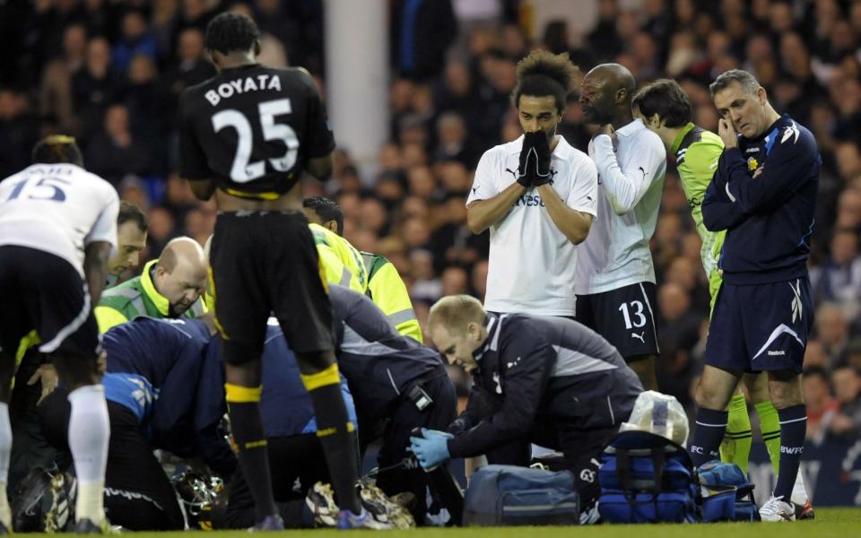 Fabrice Muamba is treated by medical staff in 2012 - he had been screened - AFP