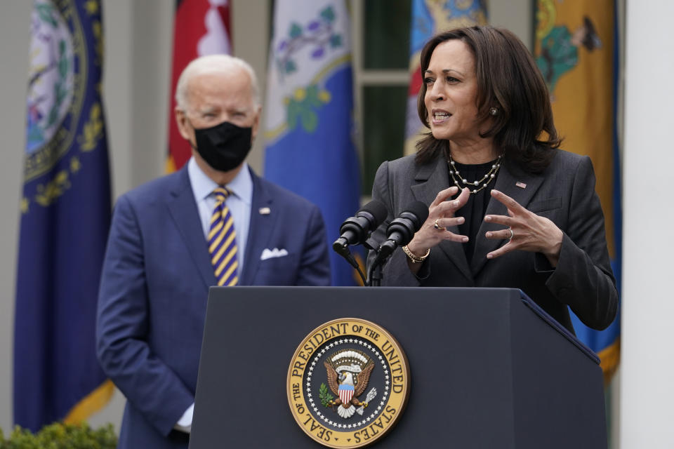 FILE - In this March 12, 2021, file photo President Joe Biden listens as Vice President Kamala Harris speaks about the American Rescue Plan, a coronavirus relief package, in the Rose Garden of the White House in Washington. (AP Photo/Alex Brandon, File)