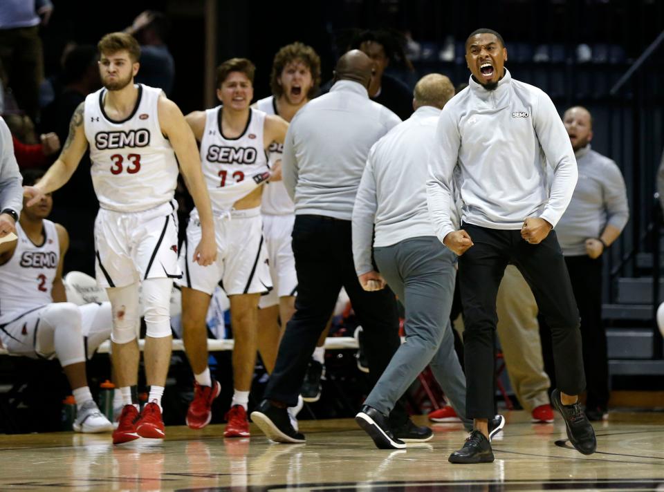 Southeast Missouri State Redhawks Assistant Coach Keith Pickens and former Missouri State Bear celebrates after the Redhawks bear the Bears at JQH Arena on Tuesday, Nov. 9, 2021.