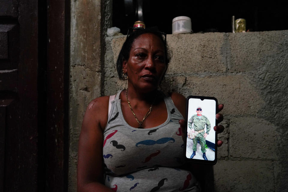 Yamidely Cervantes, 42, shows an undated photo of her husband Enrique Gonzalez, 49, dressed in military uniform in a bootcamp in Russia, La Federal, Cuba, September 19, 2023. To match Special Report CUBA-RUSSIA/ REUTERS/Alexandre Meneghini