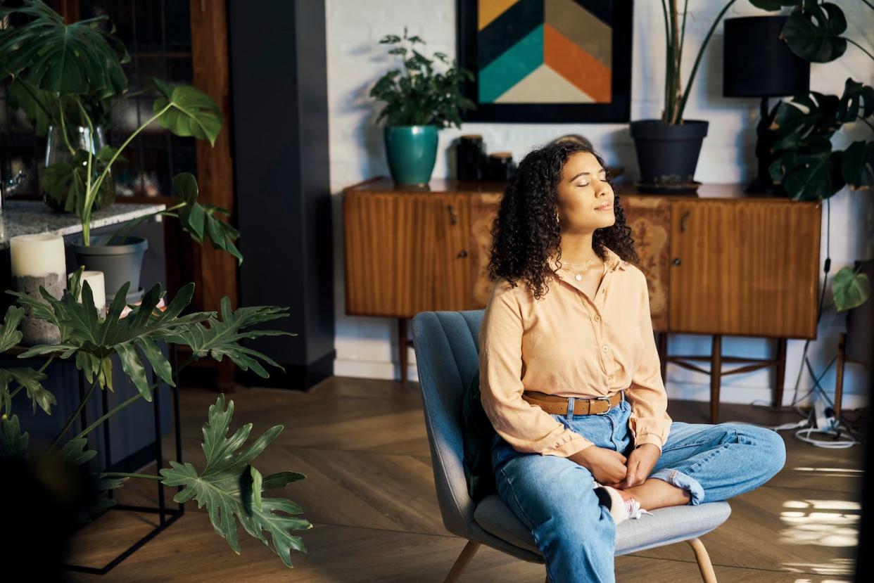 Studies show that consistent meditation practice is key. <a href="https://www.gettyimages.com/detail/photo/peace-relax-and-happy-mindset-of-a-woman-from-royalty-free-image/1421420537?phrase=meditation%20sitting%20in%20chair&adppopup=true" rel="nofollow noopener" target="_blank" data-ylk="slk:pixdeluxe/E! via Getty Images;elm:context_link;itc:0;sec:content-canvas" class="link ">pixdeluxe/E! via Getty Images</a>