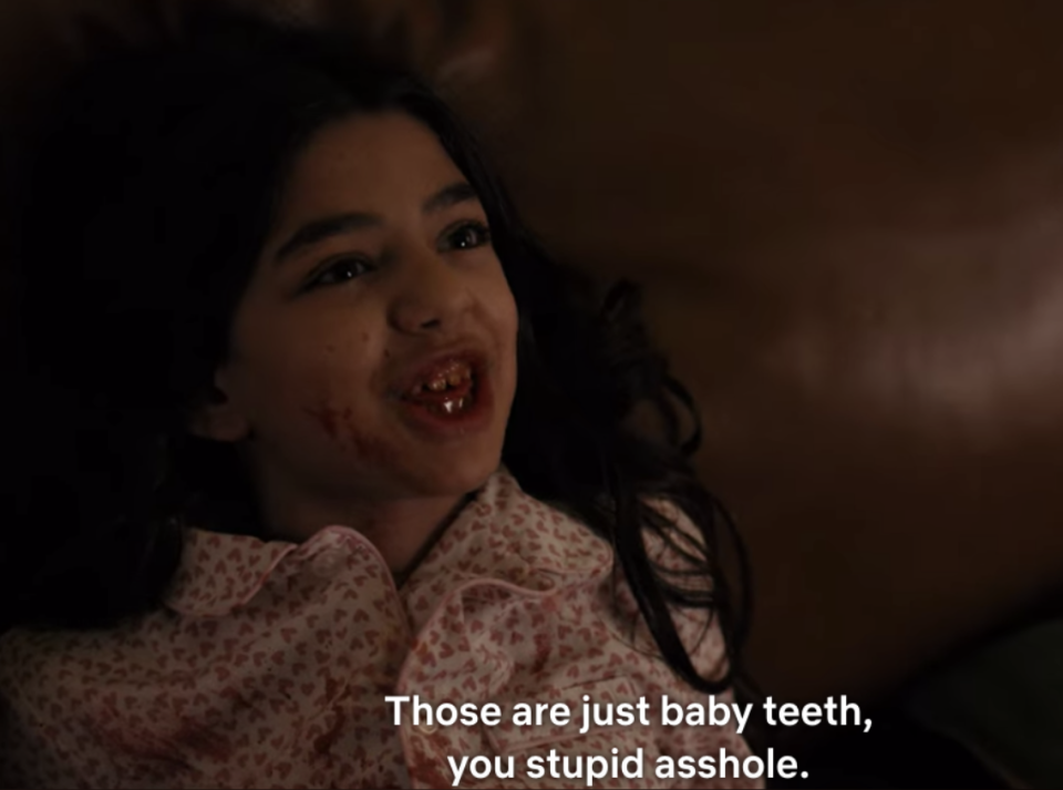 A young child is flashing her bloody teeth saying, "Those are just baby teeth, you stupid asshole."