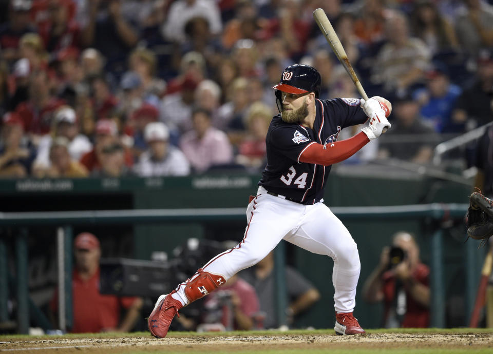 FILE - In this Sept. 21, 2018, file photo, Washington Nationals' Bryce Harper bats during a baseball game against the New York Mets, in Washington. A person familiar with the negotiations tells The Associated Press that Bryce Harper and the Philadelphia Phillies have agreed to a $330 million, 13-year contract, the largest deal in baseball history. The person spoke to the AP on condition of anonymity Thursday, Feb. 28, 2019, because the agreement is subject to a successful physical. (AP Photo/Nick Wass, File)
