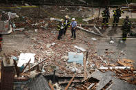 <p>Investigators stand amidst debris of a home that was destroyed by an explosion in the early morning in the Bronx borough of New York on Sept. 27, 2016. (Carlo Allegri/Reuters) </p>