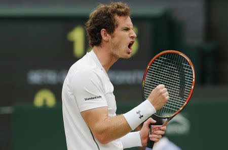 Andy Murray of Britain reacts after winning the second set of his match against Vasek Pospisil of Canada at the Wimbledon Tennis Championships in London, July 8, 2015. REUTERS/Suzanne Plunkett