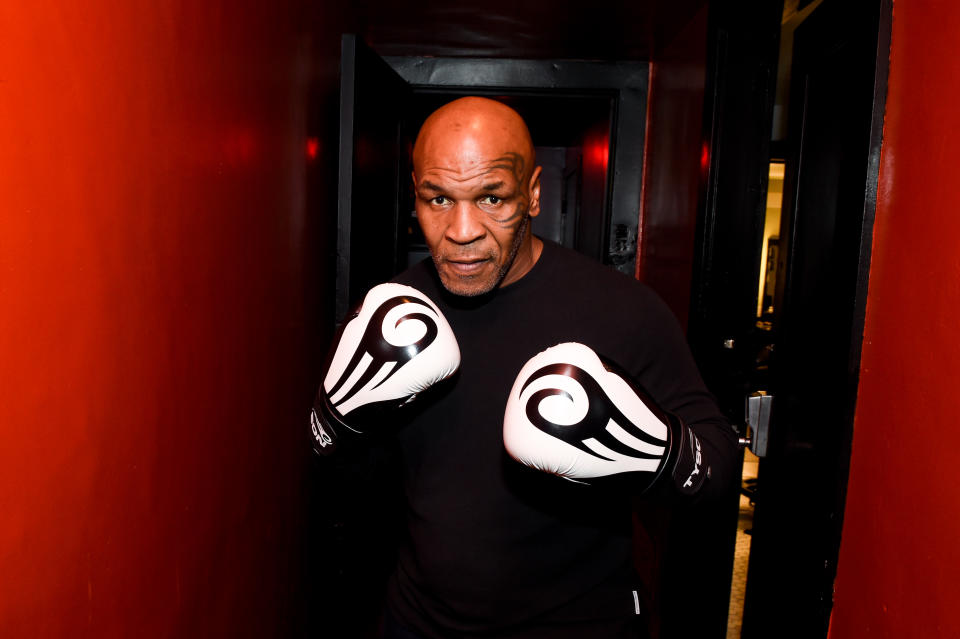 Mike Tyson wearing boxing gloves