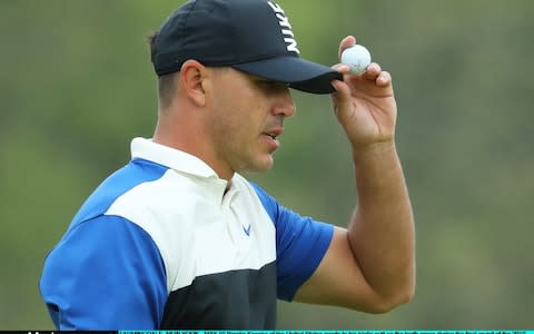 Brooks Koepka tips his cap after a birdie on the 10th - Credit: Getty Images North America