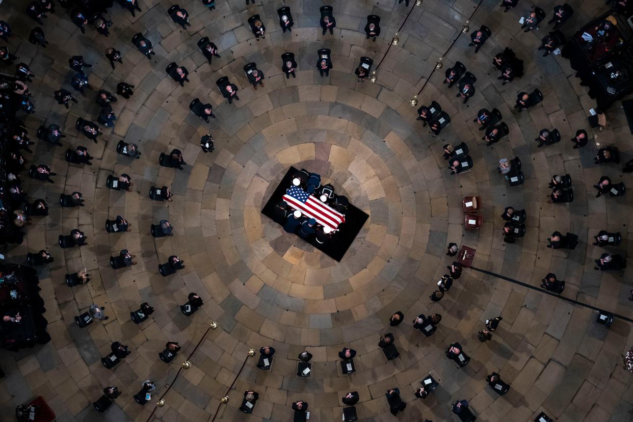 The casket of former Sen. Bob Dole, R-Kan., arrives in the Rotunda of the U.S. Capitol, where he will lie in state, Thursday, Dec. 9, 2021, on Capitol Hill in Washington, D.C.