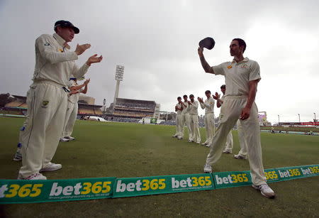 Australia's Mitchell Johnson reacts as he is clapped off the field by his team mates during the fifth day of the second cricket test match against New Zealand at the WACA ground in Perth, Western Australia, November 17, 2015. REUTERS/David Gray