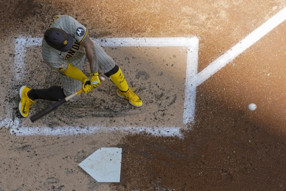 San Diego Padres' Gary Sanchez hits a two-run home run during the second inning of a baseball game against the Milwaukee Brewers Sunday, Aug. 27, 2023, in Milwaukee. (AP Photo/Morry Gash)