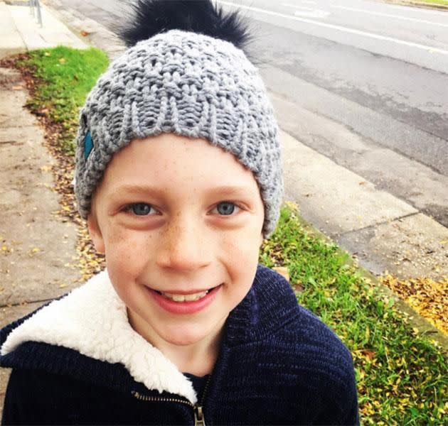 Ollie models one of his mum's charity beanies that are sold to raise funds for brain cancer. Source: @carriebickmore/Instagram