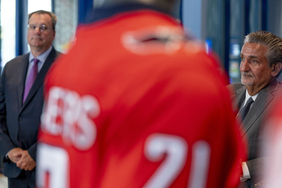 Founder & CEO of Monumental Sports & Entertainment and owner of the Washington Wizards and the Washington Capitals Ted Leonsis, right, and CEO of Caesars Entertainment CEO Tom Reeg, left, appear at a ribbon cutting for the William Hill Sportsbook at Monumental Sports & Entertainment's Capital One Arena in Washington, Wednesday, May 26, 2021. (AP Photo/Andrew Harnik)