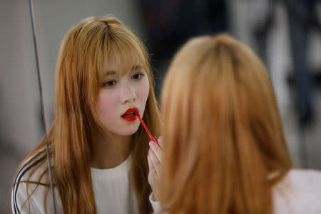 Japanese Yuho Wakamatsu, 15, who wants to become a K-pop star, adjusts her makeup during a training session in Seoul, South Korea, March 12, 2019. REUTERS/Kim Hong-Ji