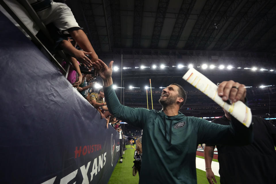 Philadelphia Eagles head coach Nick Sirianni greets fans as he walks off the field after an NFL football game against the Houston Texans in Houston, Thursday, Nov. 3, 2022. The Eagles won 29-17. (AP Photo/Eric Christian Smith)