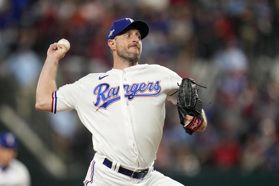 Texas Rangers starting pitcher Max Scherzer throws against the Houston Astros during the first inning in Game 3 of the baseball American League Championship Series Wednesday, Oct. 18, 2023, in Arlington, Texas. (AP Photo/Julio Cortez)