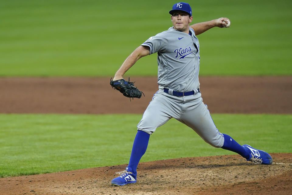 Kansas City Royals starting pitcher Kris Bubic throws during the fifth inning of the team;s baseball game against the Cincinnati Reds in Cincinnati, Tuesday, Aug. 11, 2020. (AP Photo/Bryan Woolston)